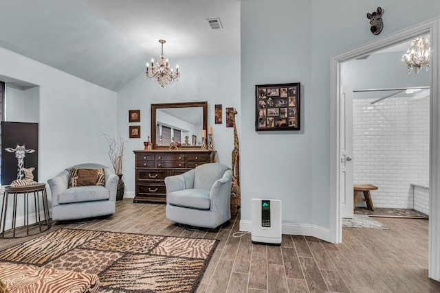 108 Gateway Dr, Alvarado, TX 76009 - living area featuring a chandelier, lofted ceiling, and wood finished floors
