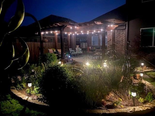 108 Gateway Dr, Alvarado, TX 76009 - yard at night featuring a patio area
