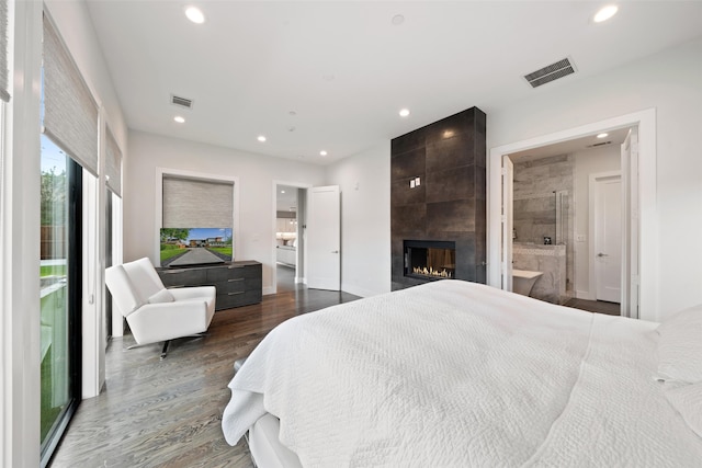 4441 Amherst Ave, University Park, TX 75225 - bedroom with a fireplace, recessed lighting, wood finished floors, and connected bathroom