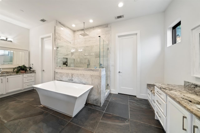 4441 Amherst Ave, University Park, TX 75225 - full bathroom with a shower stall, a freestanding bath, vanity, and recessed lighting