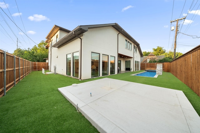 4441 Amherst Ave, University Park, TX 75225 - rear view of house with stucco siding, a fenced backyard, and a patio area