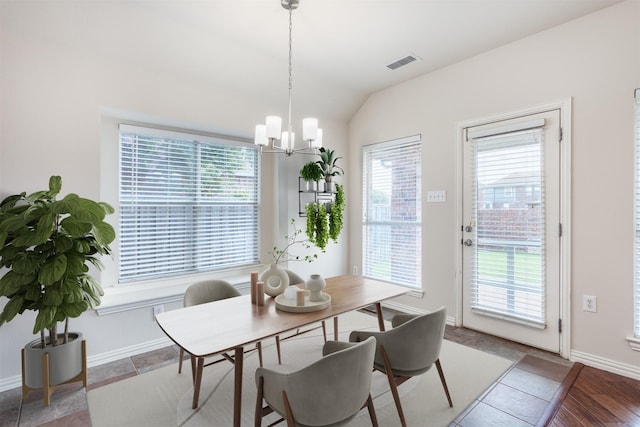 1017 Nickerson Ln, Plano, TX 75094 - dining room with healthy amount of natural light, a chandelier, and vaulted ceiling