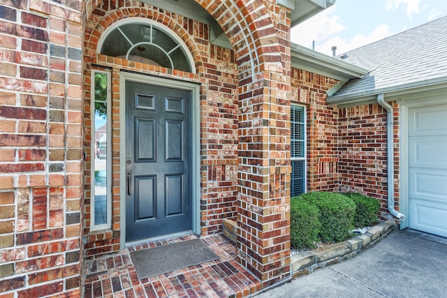 1017 Nickerson Ln, Plano, TX 75094 - doorway to property with brick siding, an attached garage, and a shingled roof