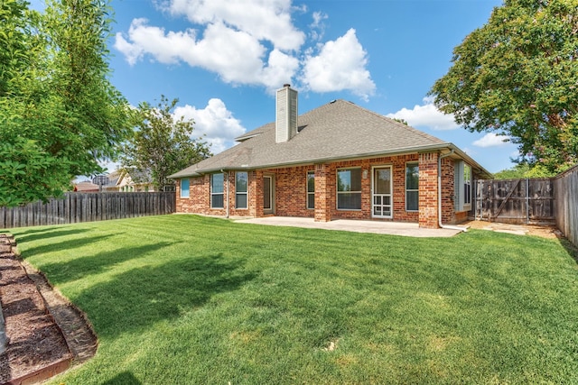 1017 Nickerson Ln, Plano, TX 75094 - back of property with a patio area, a chimney, a fenced backyard, and brick siding