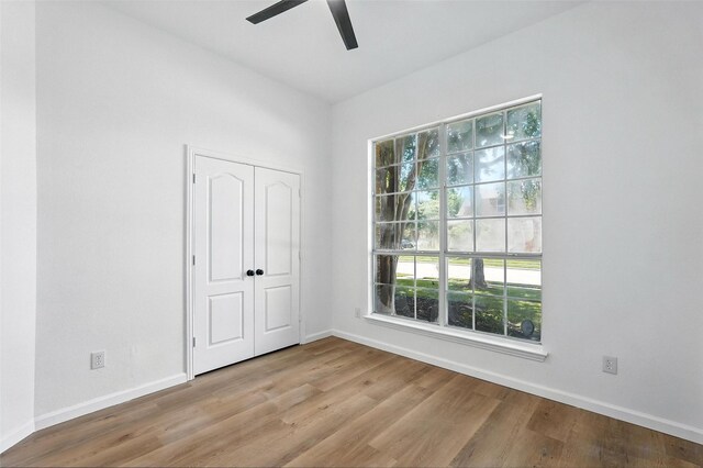 1720 Harvest Glen Dr, Allen, TX 75002 - unfurnished bedroom featuring wood finished floors, a ceiling fan, and a closet