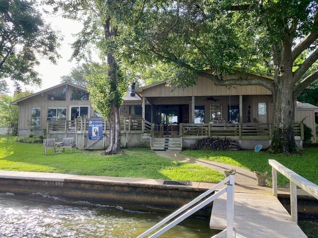 136 Cherokee Ln, Payne Springs, TX 75156 - back of house featuring ceiling fan, a yard, a water view, and a porch