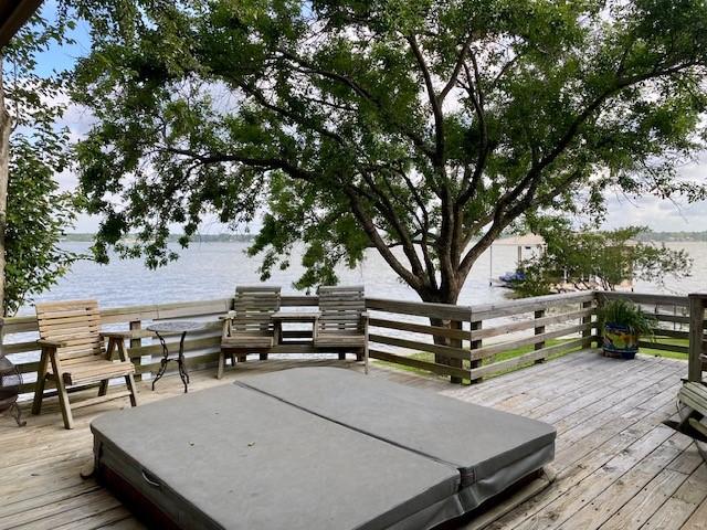 136 Cherokee Ln, Payne Springs, TX 75156 - wooden deck with a covered hot tub and a water view
