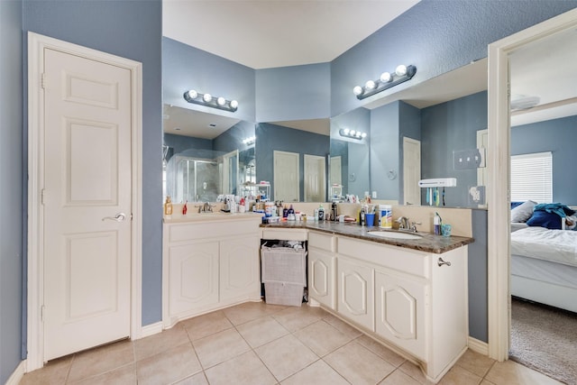 461 Running Water Trl, Fort Worth, TX 76131 - ensuite bathroom featuring tile patterned floors, a stall shower, and vanity