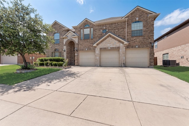 461 Running Water Trl, Fort Worth, TX 76131 - traditional-style home with brick siding, a garage, driveway, and a front yard