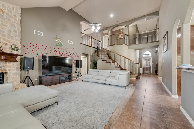 461 Running Water Trl, Fort Worth, TX 76131 - living area featuring arched walkways, high vaulted ceiling, stairs, a ceiling fan, and tile patterned floors