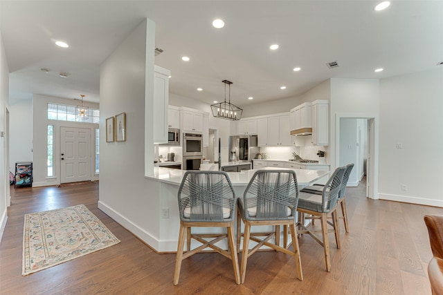 4508 Crystal Mountain Dr, Richardson, TX 75082 - dining space with wood finished floors and recessed lighting