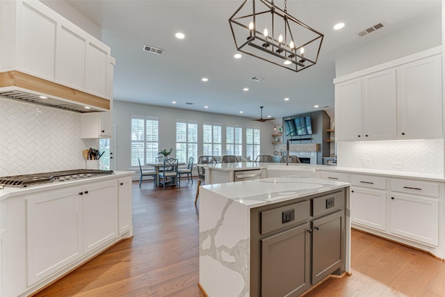 4508 Crystal Mountain Dr, Richardson, TX 75082 - kitchen with appliances with stainless steel finishes, a peninsula, backsplash, recessed lighting, and light stone counters