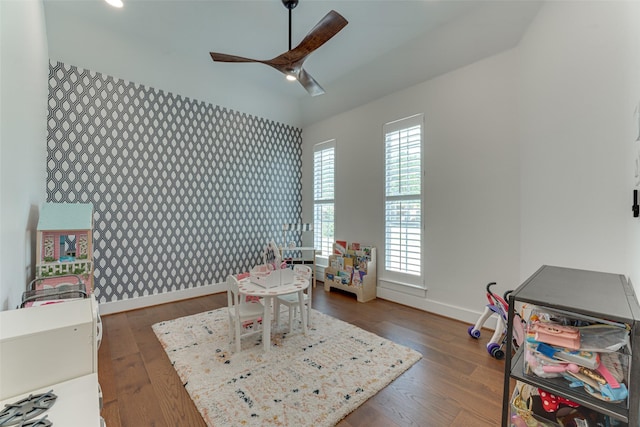 4508 Crystal Mountain Dr, Richardson, TX 75082 - rec room with wallpapered walls, an accent wall, ceiling fan, dark wood-style flooring, and recessed lighting