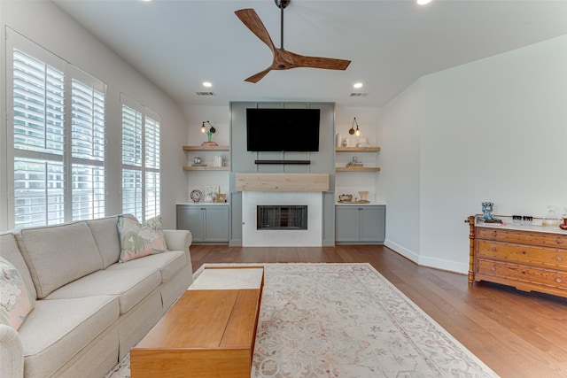 4508 Crystal Mountain Dr, Richardson, TX 75082 - living area featuring a ceiling fan, wood finished floors, a fireplace, and recessed lighting