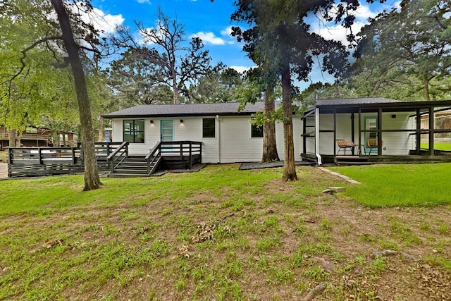 1104 Holiday Dr, Tool, TX 75143 - rear view of property featuring a lawn and a deck