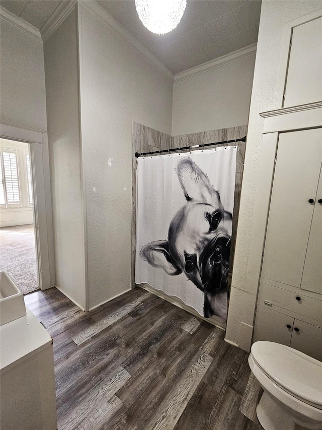 210 E Navasota St, Groesbeck, TX 76642 - full bathroom with ornamental molding, wood finished floors, and a shower with shower curtain