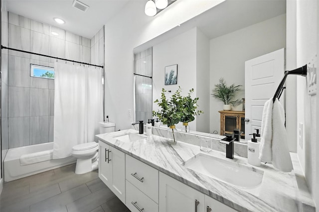 1338 E Kiest Blvd, Dallas, TX 75216 - bathroom featuring double vanity, shower / bathtub combination with curtain, and tile patterned floors