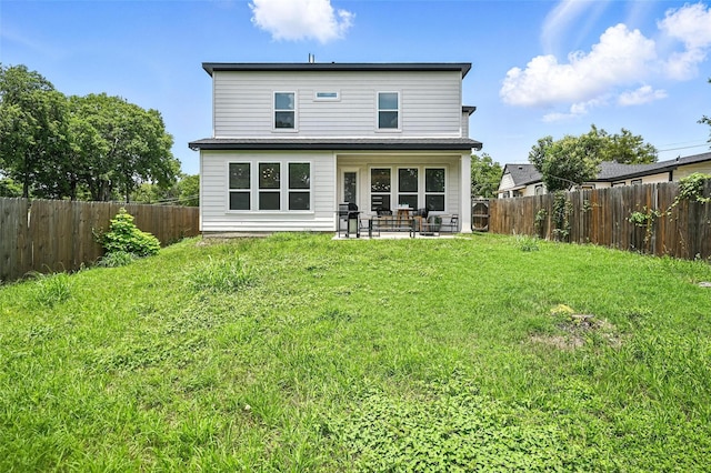 1338 E Kiest Blvd, Dallas, TX 75216 - back of property with a patio and a fenced backyard