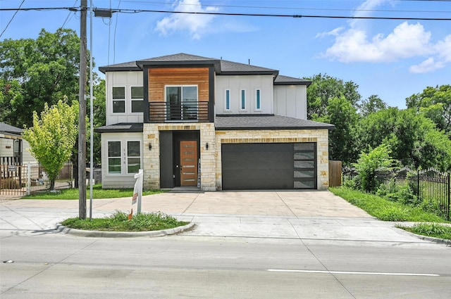 1338 E Kiest Blvd, Dallas, TX 75216 - modern home featuring stone siding, a balcony, driveway, an attached garage, and a shingled roof