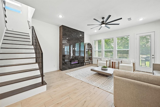 1338 E Kiest Blvd, Dallas, TX 75216 - living area with light wood-type flooring, ceiling fan, stairs, and recessed lighting