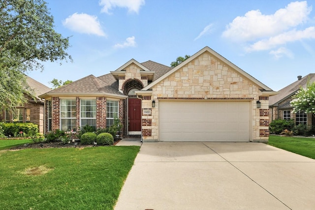 11412 Grapeleaf Dr, Fort Worth, TX 76244 - french country style house featuring stone siding, an attached garage, a front yard, and a shingled roof