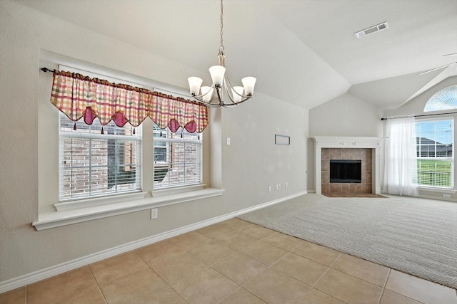 11412 Grapeleaf Dr, Fort Worth, TX 76244 - unfurnished dining area with lofted ceiling, a chandelier, tile patterned floors, and a tile fireplace