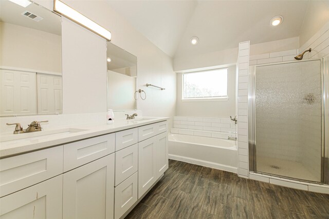 813 Ridgemont Dr, Allen, TX 75002 - bathroom featuring double vanity, a garden tub, a shower stall, lofted ceiling, and recessed lighting