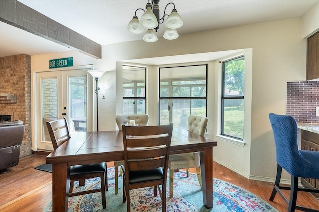 5705 Kingstree Ct, Arlington, TX 76017 - dining room featuring a chandelier, wood finished floors, and french doors