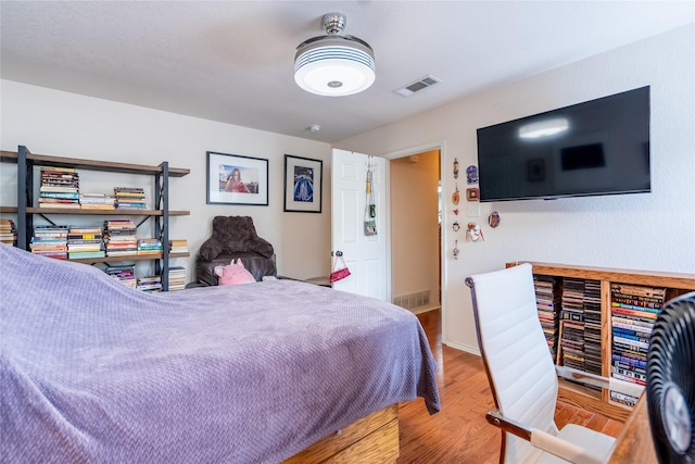 5705 Kingstree Ct, Arlington, TX 76017 - bedroom featuring wood finished floors and baseboards