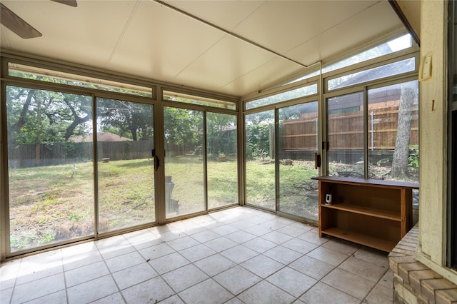 5705 Kingstree Ct, Arlington, TX 76017 - unfurnished sunroom featuring tile patterned flooring, floor to ceiling windows, and vaulted ceiling
