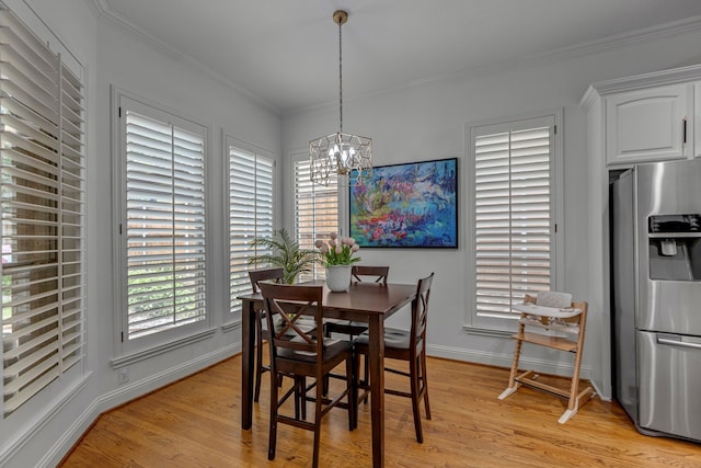 2248 Forest Hollow Park, Dallas, TX 75228 - dining space with light wood finished floors, a chandelier, and ornamental molding
