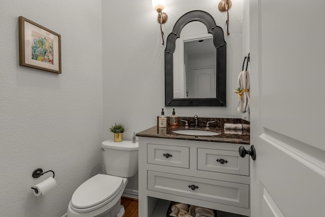 2248 Forest Hollow Park, Dallas, TX 75228 - half bathroom with vanity and wood finished floors