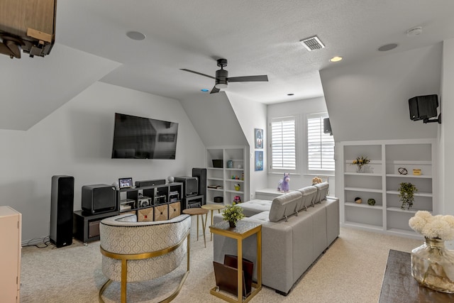2248 Forest Hollow Park, Dallas, TX 75228 - living room featuring built in shelves, light colored carpet, a ceiling fan, vaulted ceiling, and a textured ceiling
