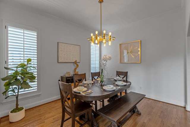 2248 Forest Hollow Park, Dallas, TX 75228 - dining room featuring crown molding, light wood-style floors, and a chandelier