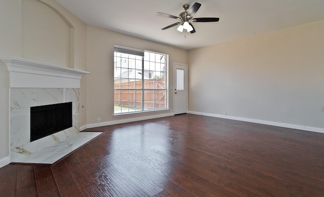 2505 Hunters Run Dr, Plano, TX 75025 - unfurnished living room with wood finished floors, a ceiling fan, and a fireplace