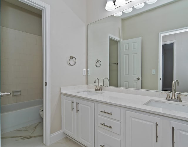 2505 Hunters Run Dr, Plano, TX 75025 - bathroom with double vanity, marble finish floors, and tub / shower combination