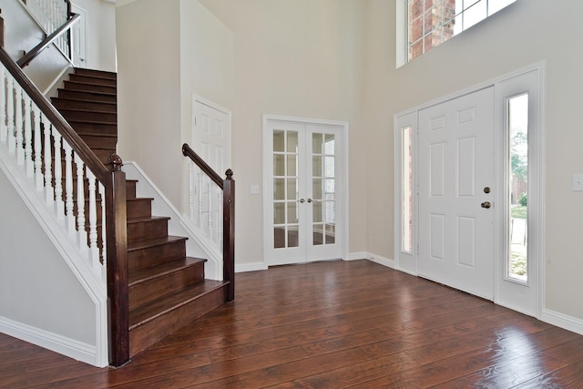 2505 Hunters Run Dr, Plano, TX 75025 - entrance foyer featuring french doors, dark wood finished floors, stairway, and a towering ceiling