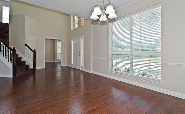 2505 Hunters Run Dr, Plano, TX 75025 - foyer entrance featuring a chandelier, stairway, and dark wood-style floors