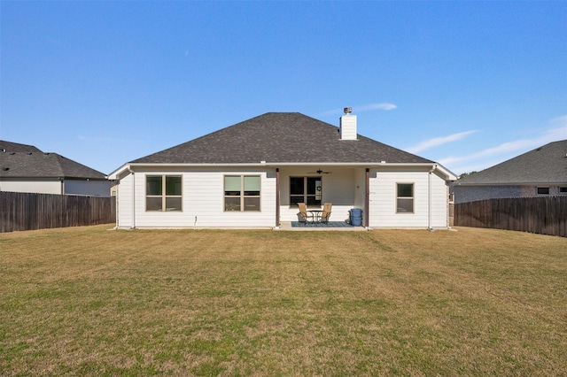 6105 Parma Ln, Temple, TX 76502 - back of house with a fenced backyard, a ceiling fan, a patio area, and a chimney