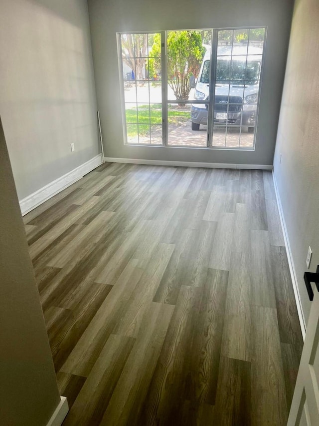 3633 Flamingo Way, Mesquite, TX 75150 - unfurnished room featuring wood finished floors and healthy amount of natural light