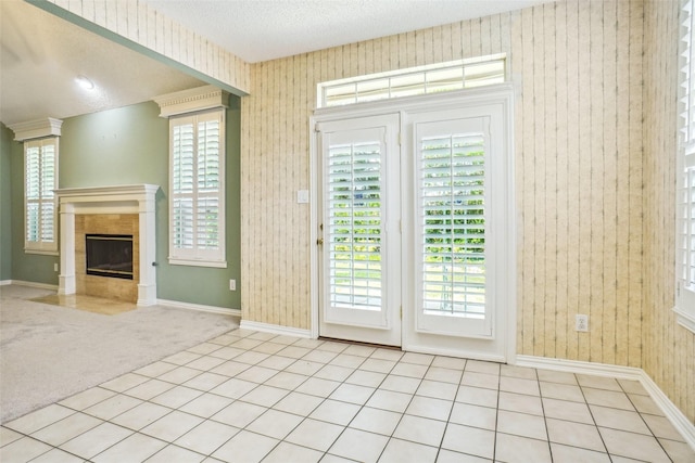 448 Shade Tree Cir, Hurst, TX 76054 - doorway to outside featuring carpet flooring, a fireplace, and a textured ceiling