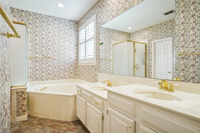 448 Shade Tree Cir, Hurst, TX 76054 - bathroom with wallpapered walls, double vanity, a textured ceiling, a garden tub, and a stall shower