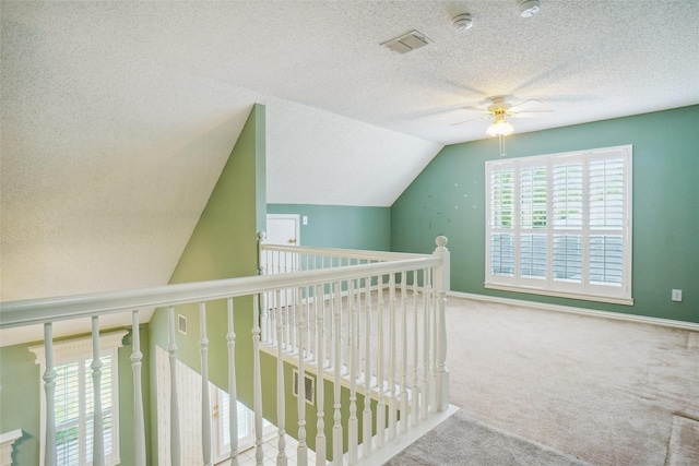448 Shade Tree Cir, Hurst, TX 76054 - hall featuring a textured ceiling, carpet floors, and vaulted ceiling