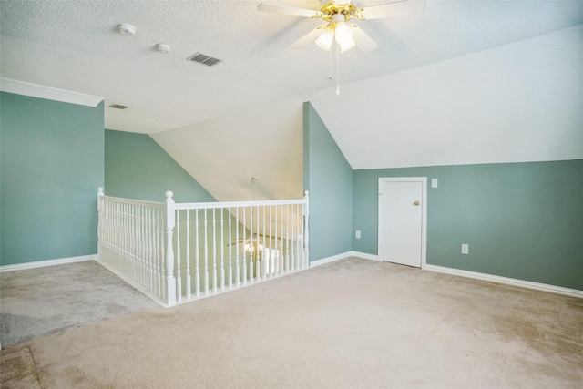 448 Shade Tree Cir, Hurst, TX 76054 - bonus room featuring ceiling fan, carpet flooring, lofted ceiling, and a textured ceiling
