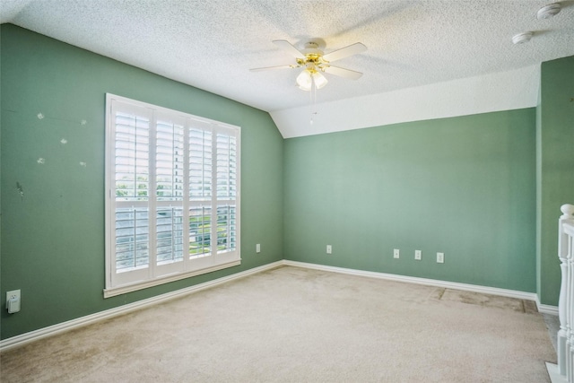 448 Shade Tree Cir, Hurst, TX 76054 - carpeted empty room featuring a smoke detector, ceiling fan, vaulted ceiling, and a textured ceiling