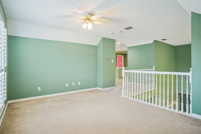 448 Shade Tree Cir, Hurst, TX 76054 - carpeted empty room featuring a ceiling fan and a textured ceiling