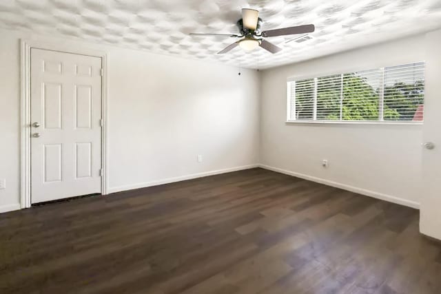 2023 Windchime Dr, Dallas, TX 75224 - spare room with a ceiling fan and dark wood-style flooring