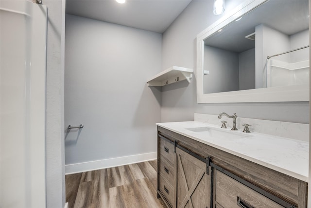 606 E 12th St, Bonham, TX 75418 - full bath featuring vanity, wood finished floors, and a shower
