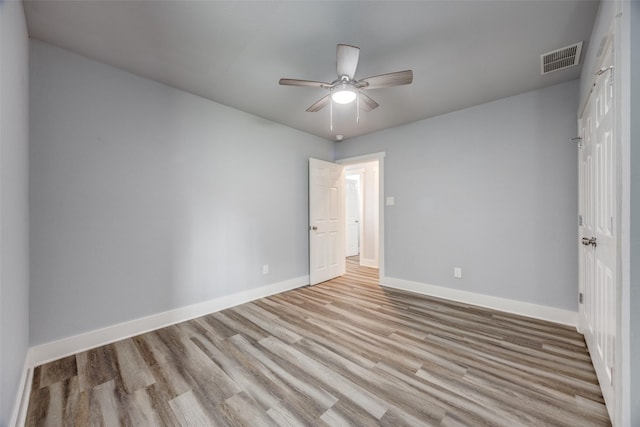 606 E 12th St, Bonham, TX 75418 - unfurnished bedroom with light wood-type flooring and ceiling fan