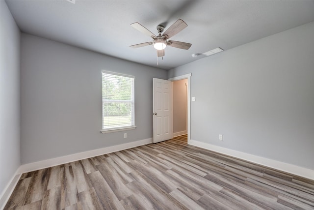 606 E 12th St, Bonham, TX 75418 - empty room featuring wood finished floors and a ceiling fan